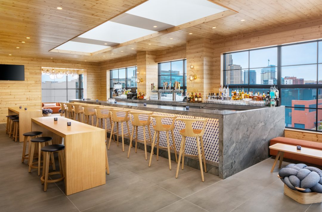 Bar with stools and a view out to the city